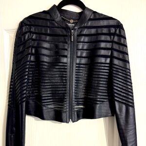 Bebe “Leather and Lace” style cropped jacket in black